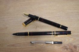 A boxed Waterman Laureat converter fill fountain pen and rollerball pen in Brown Shadow, the