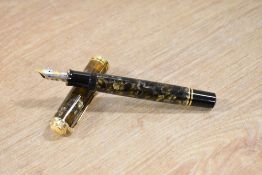 A boxed Pelikan M800 piston fill fountain fountain pen in Brown and Pearl having a Pelikan 18C 750 M