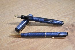 A boxed Mabie Todd & Co Swan SM205/83 lever fill fountain pen and propelling pencil set in Blue