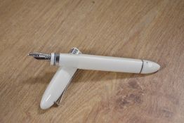 A boxed Omas 360 piston fill fountain pen in Iceberg White, this triangular shaped pen with greek