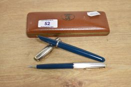 A boxed Parker 51 aerometric fill fountain pen and propelling pencil in Teal Blue with rolled silver