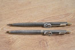 A boxed Parker 75 ballpoint pen and propelling pencil in Sterling Silver Cisele. With original price