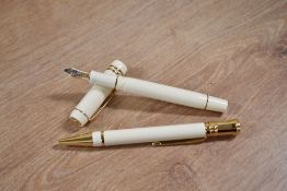 A boxed Parker Duofold International converter fill fountain pen and ballpoint pen in Ivorine with
