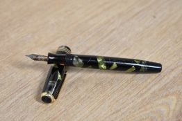 A Parker Duofold Deluxe Challenger Junior button fill fountain pen in Green and Black marble with