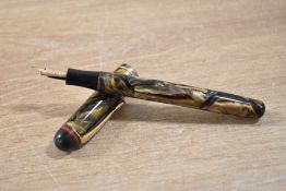 An Esterbrook Relief 2-L lever fill fountain pen in caramel swirl with single narrow cap bands