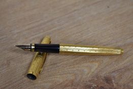 A Parker 75 converter fill fountain pen in gold Perle pattern having Parker 585 France nib