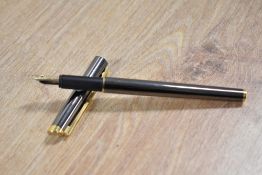 A Dunhills Slimline converter fill fountain pen in Silver Grey having Dunhill 585 14K nib