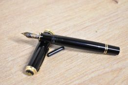 A boxed Pelikan M800 Souveran piston fill fountain pen in black having Pelikan 18C 750 F nib.