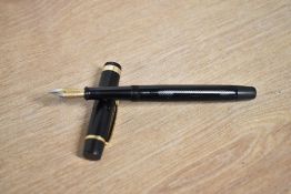 A boxed De La Rue Onoto the Pen 6234 plunger fill fountain pen in Black engine turned pattern with
