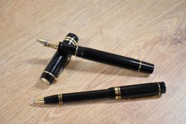 A boxed Parker Duofold Centennial converter fill fountain pen and ballpoint pen in Black with two