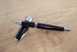 A boxed Cross Apogee rollerball in Black Star laque and chrome