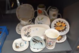 Three Midwinter Stonehenge 'Summer' pattern side plates featuring stylized orange and yellow flowers