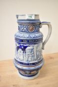 A 20th century German Westerwald blue glaze stoneware beer stein depicting a farm scene, having text