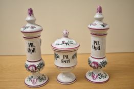 A group of three continental hand-decorated crackle glazed pottery apothecary jars, Pil Opii (x2)