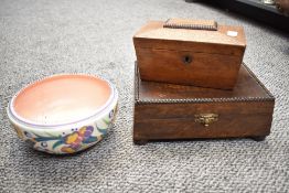 A group of two Victorian wooden boxes, comprising a tea caddy of sarcophagus form and an empty