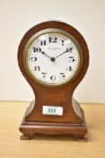 An early 20th century mahogany cased balloon shaped mantel clock, the enamelled dial with Arabic