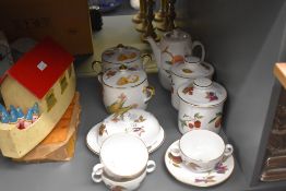 A Royal Worcester bone china 'Evesham' pattern dinner/tea service including four lidded storage