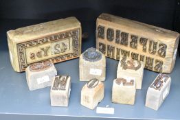 A group of interesting letter press printing blocks, one with removable/interchangeable number