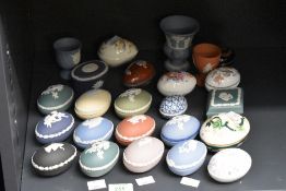 A collection of eleven Wedgwood Jasper ware egg form trinket boxes, including Lemon, green and