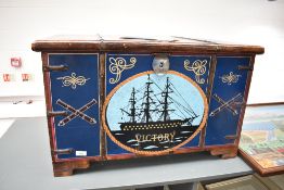 A large decorative hand-painted captain's or similar chest having maritime themed paintwork,