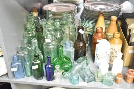 A selection of 19th- to 20th-century glassware, including apothecary, brewery, and medicinal bottles
