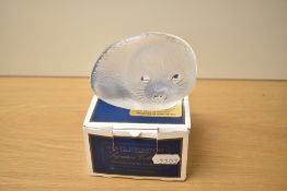 A Mats Jonasson lead crystal paperweight, moulded in the form of a seal cub, etched signature to