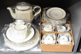 A modern Noritake bone china 'Paris' tea service, of a soft ivory colouration with a gilded rim,