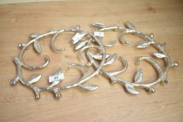 A pair of contemporary Michael Aram metal trivets, of vine leaf form, marked to base, (2).