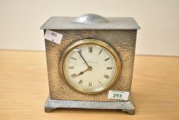 A 20th-century Walker and Hall of Sheffield white metal mantle clock, featuring a hammered case with