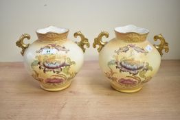 Two Victorian S. Fielding and Company pottery baluster vases with double gilded handles, renamed