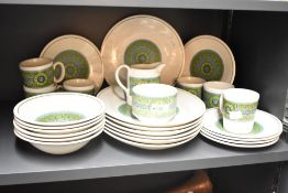 A 1970's ceramic part dinner/tea service having a distinctive green, brown and blue geometric