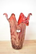 A large 20th-century Murano-style art glass vase, of a red abstracted form with gold detailing,