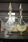 A pair of Victorian glass apothecary carboys, hand-blown with tall cylindrical bodies and conical