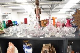 A large selection of 20th-century crystal cut glassware pieces, including decanters, a pair of