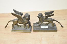 Two Victorian gilt bronze winged lion of St Mark paperweights, each raised on rectangular bases,
