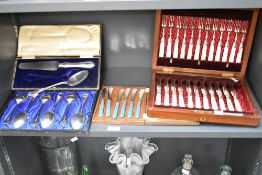 A large quantity of 20th-century silver-plated and white metal cutlery, featuring an ornately
