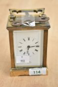A late 19th to early 20th-century St. James London brass carriage mantel clock, sold with a