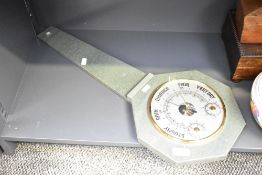 A large green slate barometer with brass surround, measures 65cm long.