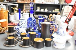 An Art Deco Carlton Ware porcelain coffee set, having orange lustre and gilt handles contrasted to