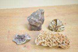 A collection of four assorted minerals, unknown age, including amethyst clusters and a desert rose