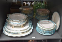 A 19th century blue and white porcelain part dinner service, having light blue and gilt edging to