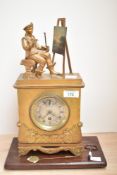 A Robert.A.Paris mid-19th century gilted brass mantel clock, unusually surmounted with a depiction