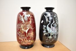 Two Oriental lacquered vases having inlaid mother of pearl work, both having bird and floral motifs,