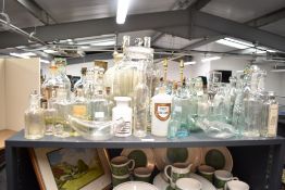 A large quantity of Victorian apothecary jars and glassware, to include medicinal bottles, glass