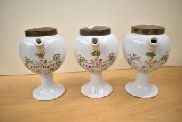 A group of three reproduction continental pottery wet drug jars, of globular form with short spout
