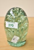A Victorian green glass 'dump' paperweight, of typical form with controlled bubble inclusions 12cm