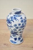 A Chinese blue and white porcelain prunus vase, presumed Kangxi period, of ovoid form with short