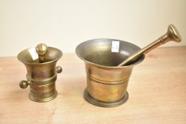 Two Victorian brass apothecary pestles and mortars, (2), condition consistent with age and use.