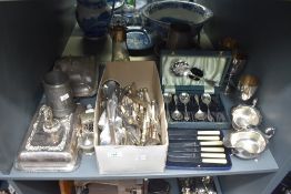 A large selection of silver-plated ware including sauce boats, lidded tureens together with an