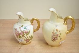 A pair of Victorian Royal Worcester porcelain blush ivory jugs, of bulbous form with gilded handles,